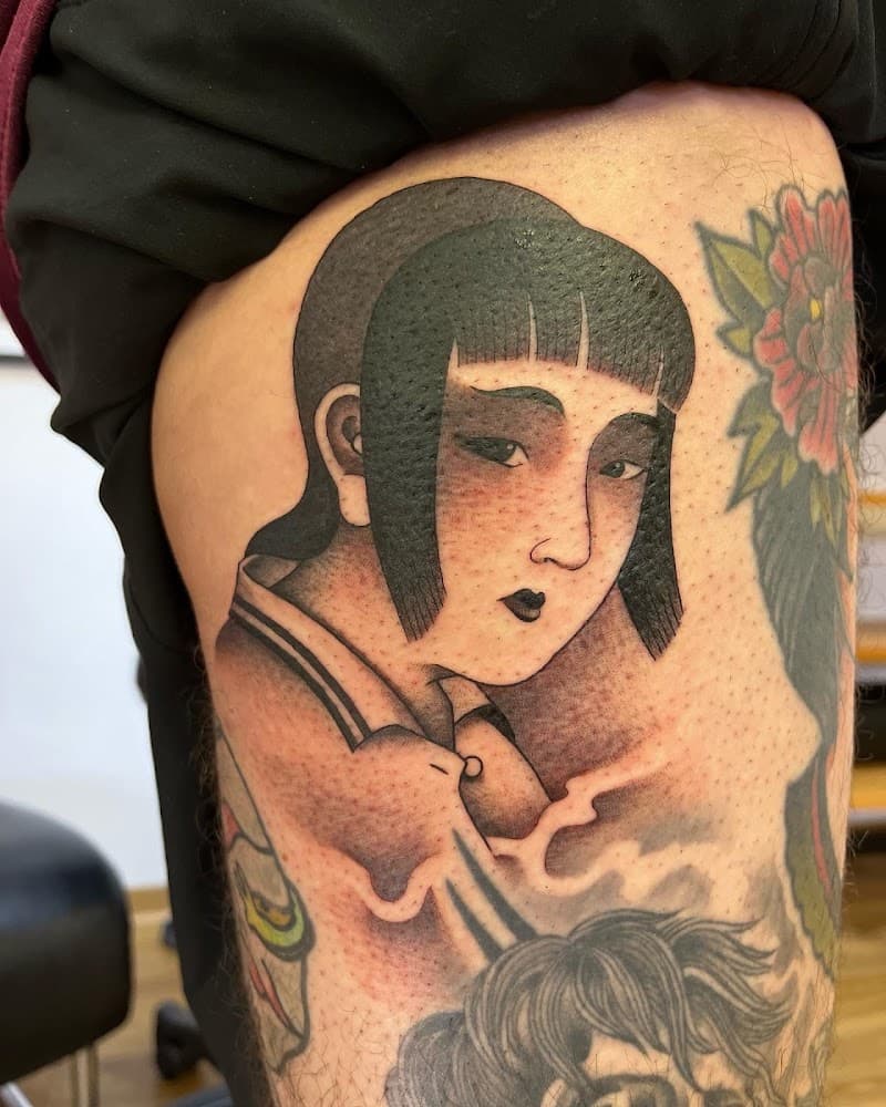 Traditional tattoo van een Japanse vrouw op het bovenbeen.