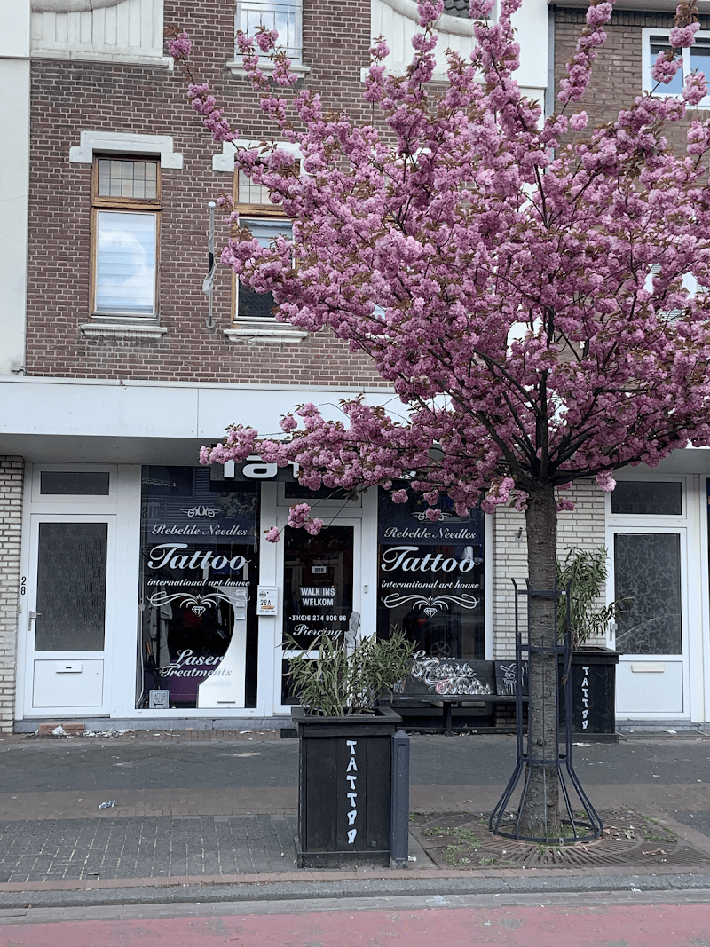 Rebelde Needles Tattoo