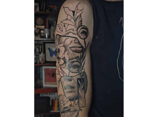 Surrealistische half-sleeve met gezichtsfragmenten, bloemen en een slak.