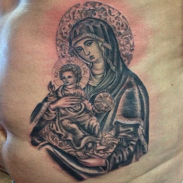 Blackwork tattoo van Maria met kindje Jezus op de ribben.