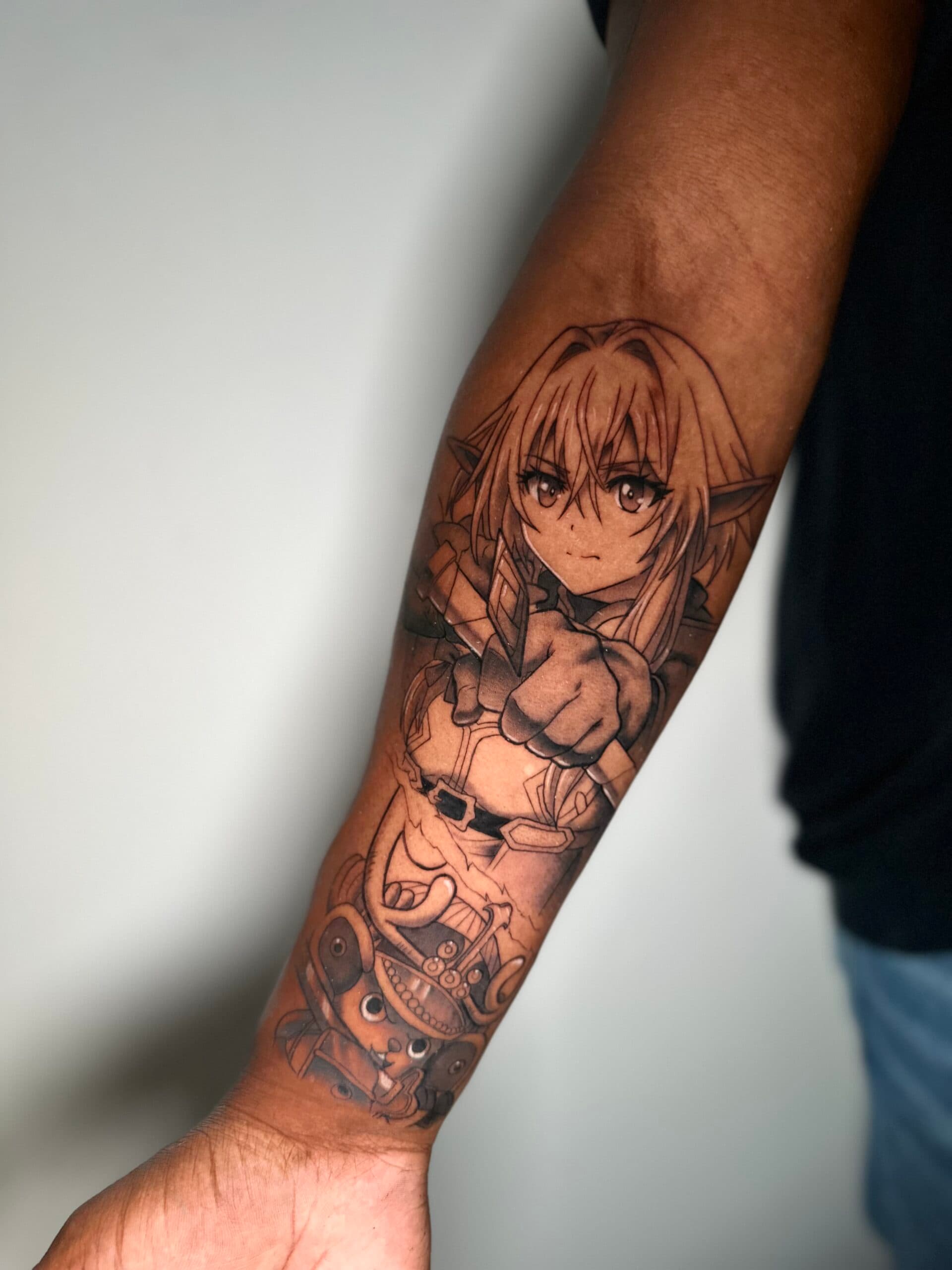 Anime tattoo van High Elf Archer en Chopper op onderarm.